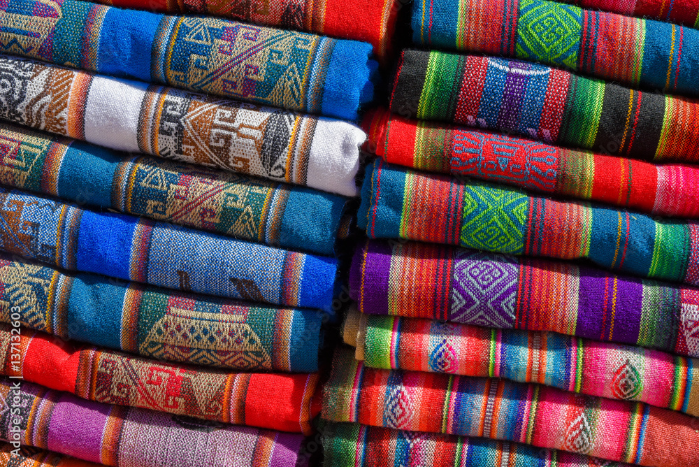 A pile of colorful rugged Peruvian textile and fabrics. A pile of colorful rugged Peruvian textile and fabrics.