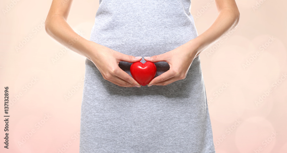 Gynecology concept. Young woman on color background Gynecology concept. Young woman on color background