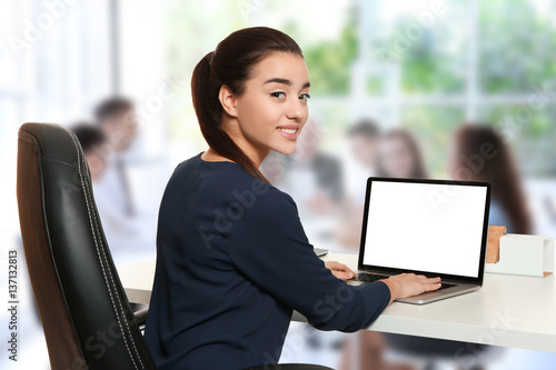Young businesswoman working...