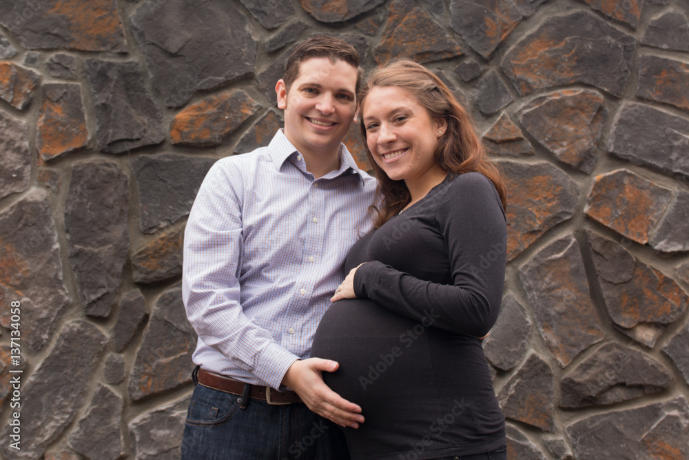 Portrait of a young pregnant couple