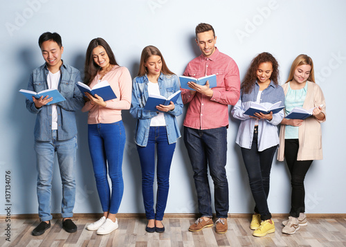 Group of people with books ...