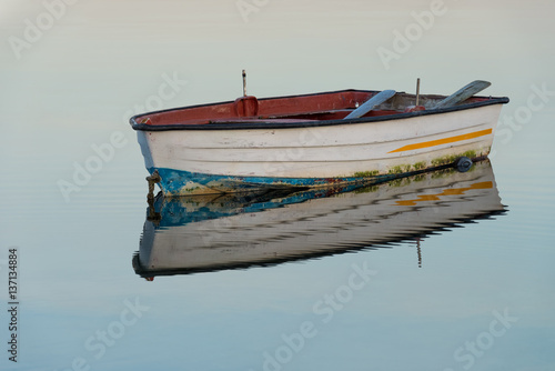 wooden fishing boat on a background of water
