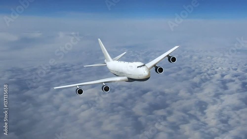 Plane flying above the clouds, airplane in flight, front view