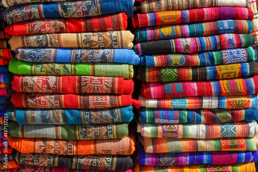 A pile of colorful rugged Peruvian textile and fabrics. A pile of colorful rugged Peruvian textile and fabrics.