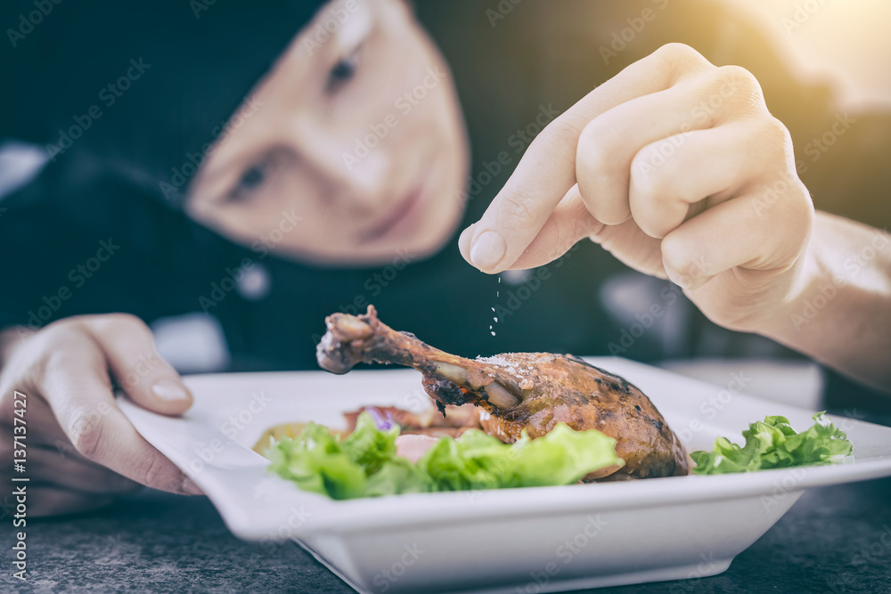 The chef prepares a gourmet meal.