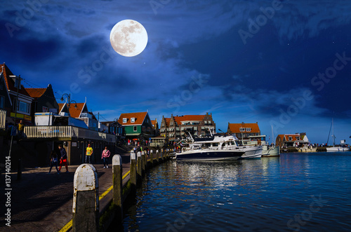 Traditional houses and small vessels in Holland town Volendam, Netherlands photo