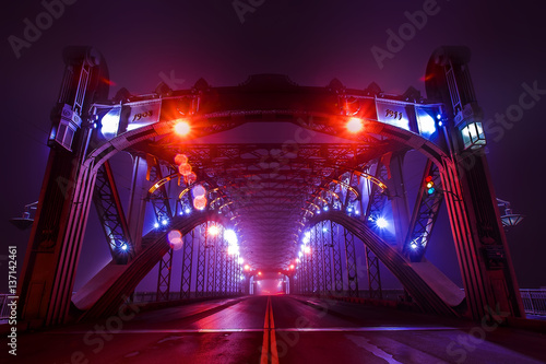 Bridge in the fog illuminated