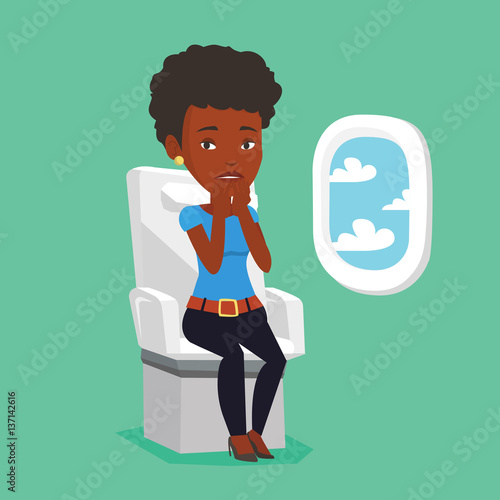 Young woman suffering from fear of flying.