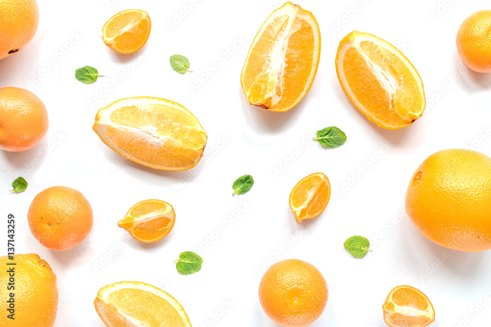Cut oranges for juicy breakfast on white background top view pattern Cut oranges for juicy breakfast on white background top view pattern