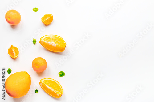 Orange fruits on white background top view mock up
