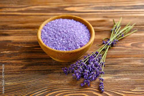 Sea salt with lavender on wooden background