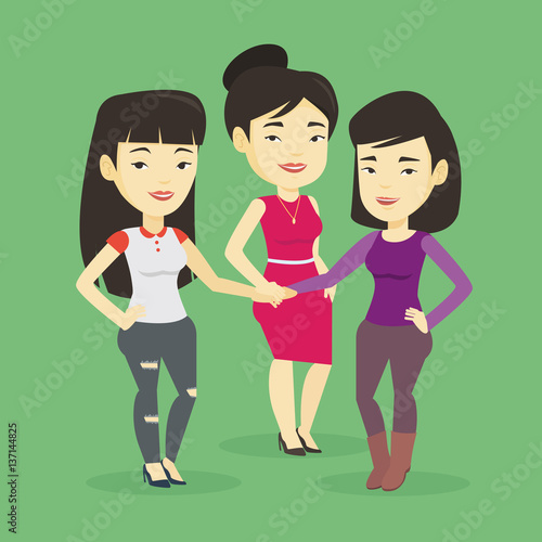 Group of business women joining hands.