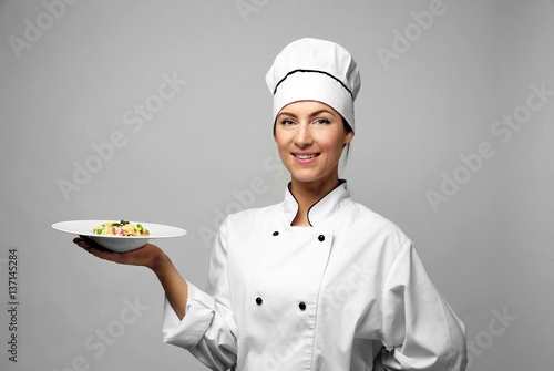 Portrait of female chef wit...