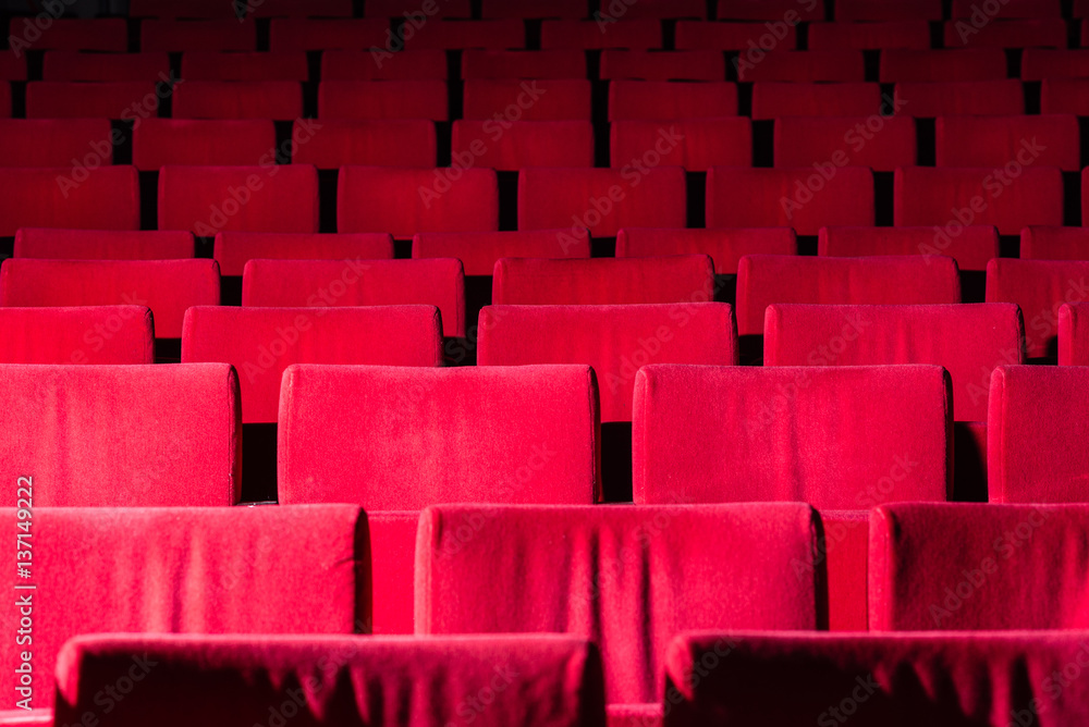 Obraz premium Rows of red velvet theater seats.