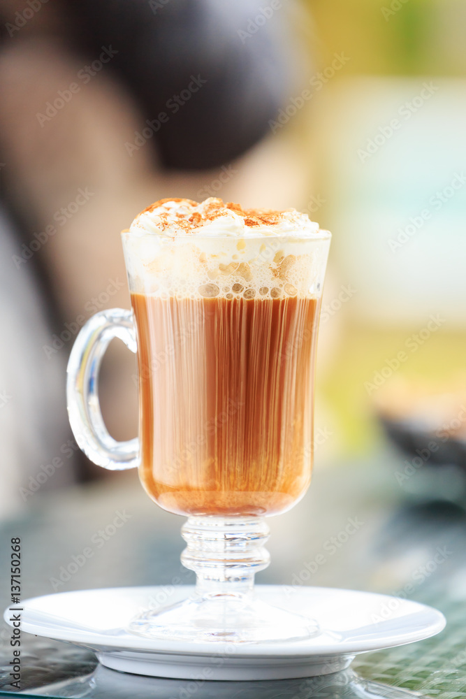 Irish coffee in an outdoor bar. Concept of St Patrick holiday. Holiday background Irish coffee in an outdoor bar. Concept of St Patrick holiday. Holiday background