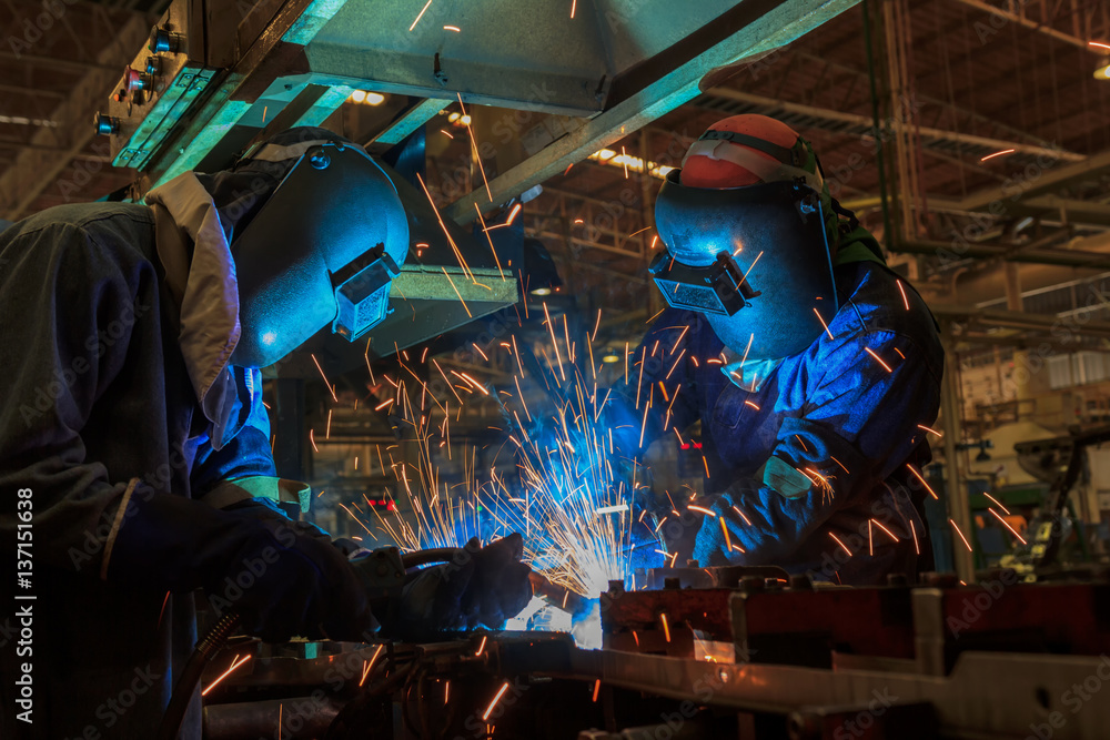 Workers are welding in factory