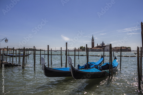 Gondolas and San Giorgio maggiore, view from San Marco square, in Venice, Italy