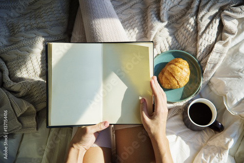 Woman Reading Book Novel On Bed Breakfast Morning photo