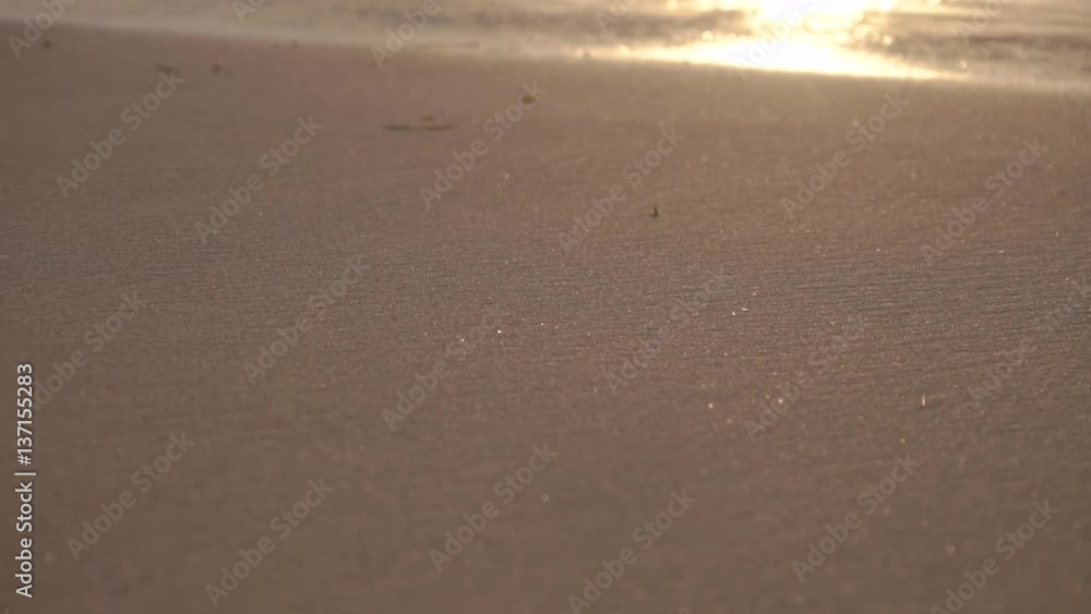 Sandy beach background at sunrise, slow motion 120fps Sandy beach background at sunrise, slow motion 120fps