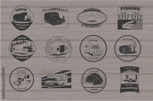 vintage camping and outdoor adventure emblems, logos and badges. Camping equipment. Camp trailer in the forest on wood background.
