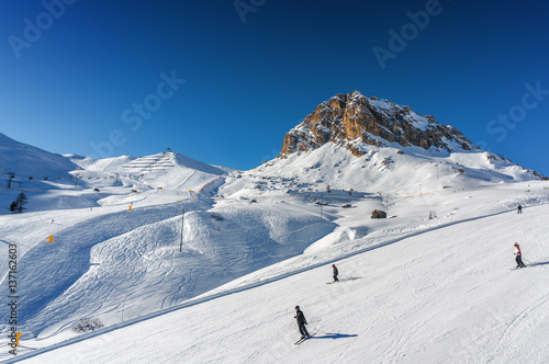 Sunny view of ski slope at snow valley near Canazei of Val di Fassa, Trentino-Alto-Adige region, Italy.