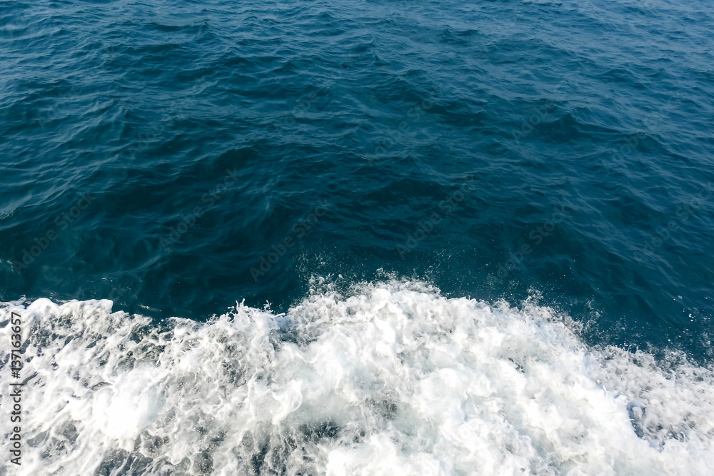 Deep blue sea and white water splash Deep blue sea and white water splash