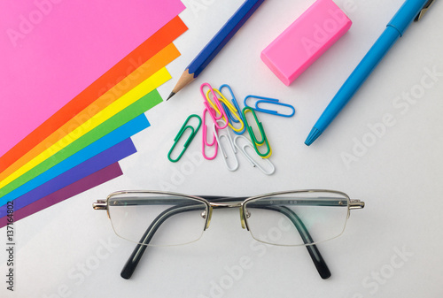 Office supplies with reading glassess.