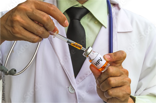 Male doctor push syringe in  HPV vaccine on hand,indicated prevention of cancer.On white background saved with clipping path.