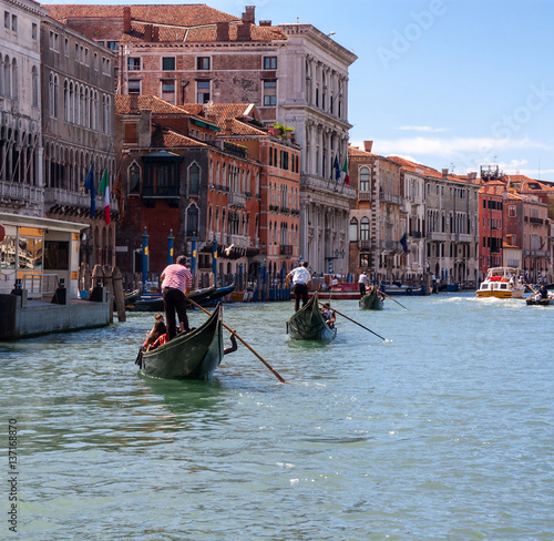 GONDOLAS ON CANAL GRANDE IN VENICE, ITALY