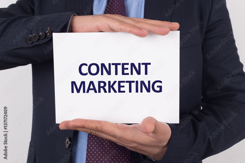 Man showing paper with CONTENT MARKETING text Man showing paper with CONTENT MARKETING text