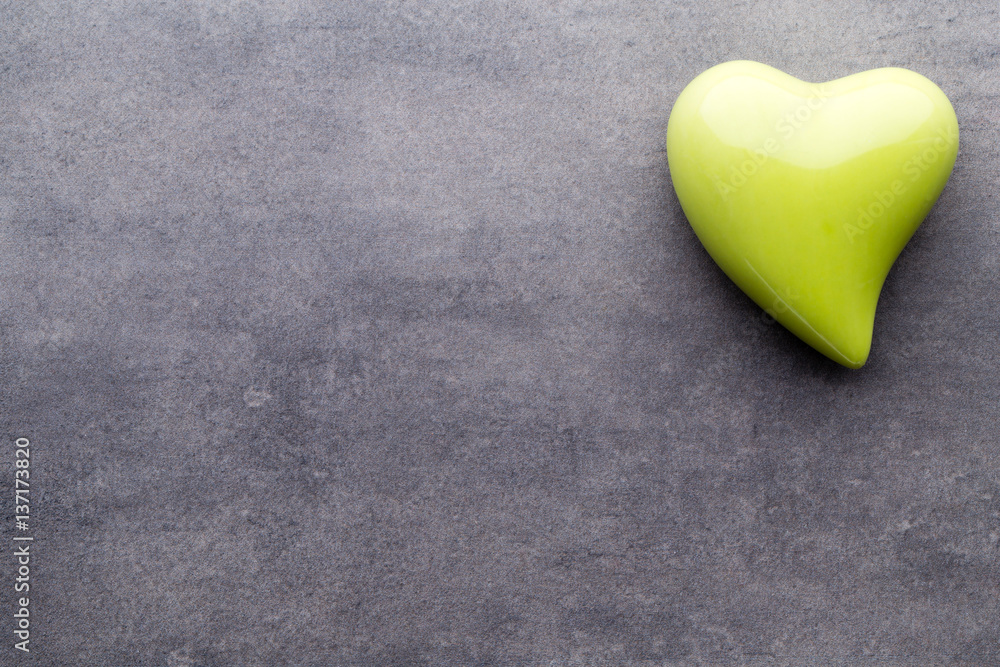 Fototapeta premium Colored heart on the gray background.