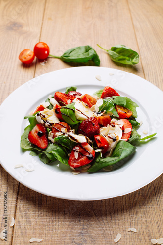 strawberry salad on wooden desk
