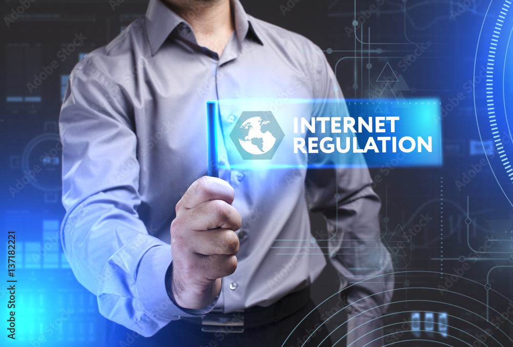Business, Technology, Internet and network concept. Young businessman showing a word in a virtual tablet of the future: Internet regulation Business, Technology, Internet and network concept. Young businessman showing a word in a virtual tablet of the future: Internet regulation