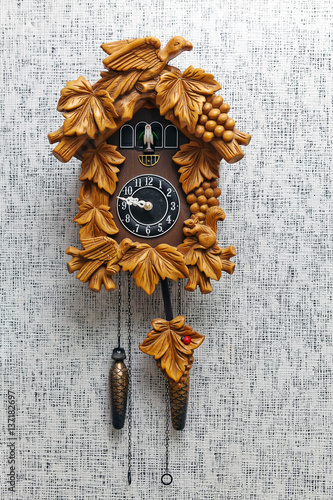 old fashioned wall clock with pendulum