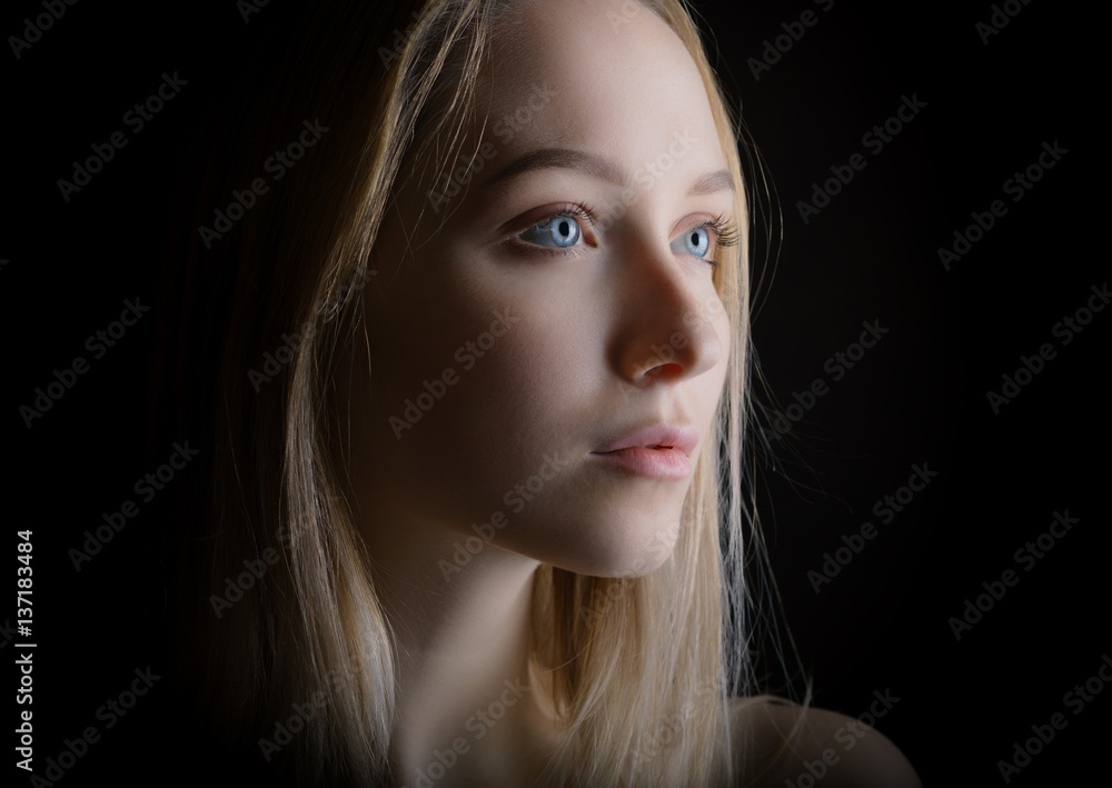 Portrait of a beautiful young woman with blue eyes. Stock Photo | Adobe ...