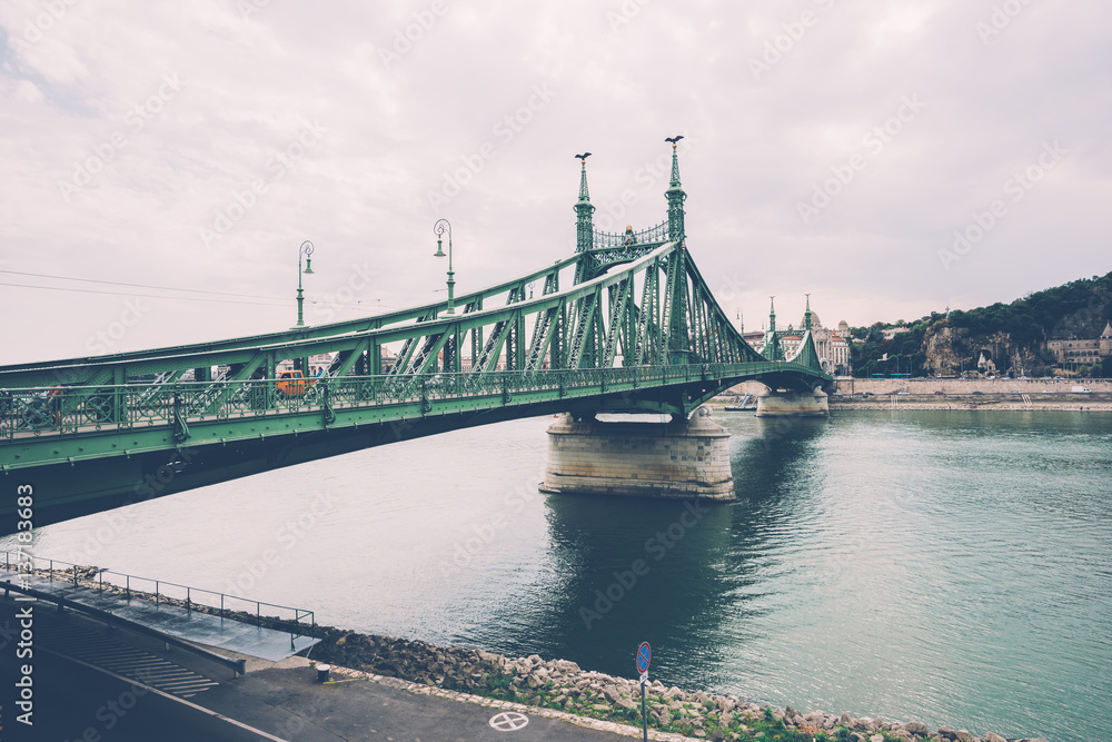 View of  in a cloudy day of Liberty Bridge (Chain Bridge) over Danube river in Budapest
