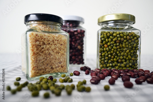 Beans and grains in square glass jar