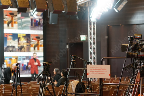 Photography Berlin, Germany - February 13, 2017: photographers and cameramen equipments in empty conference hall
