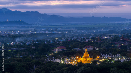 Beautiful Khuthodaw Pagoda with light in the early morning view from Mandalay hill, Myanmar photo