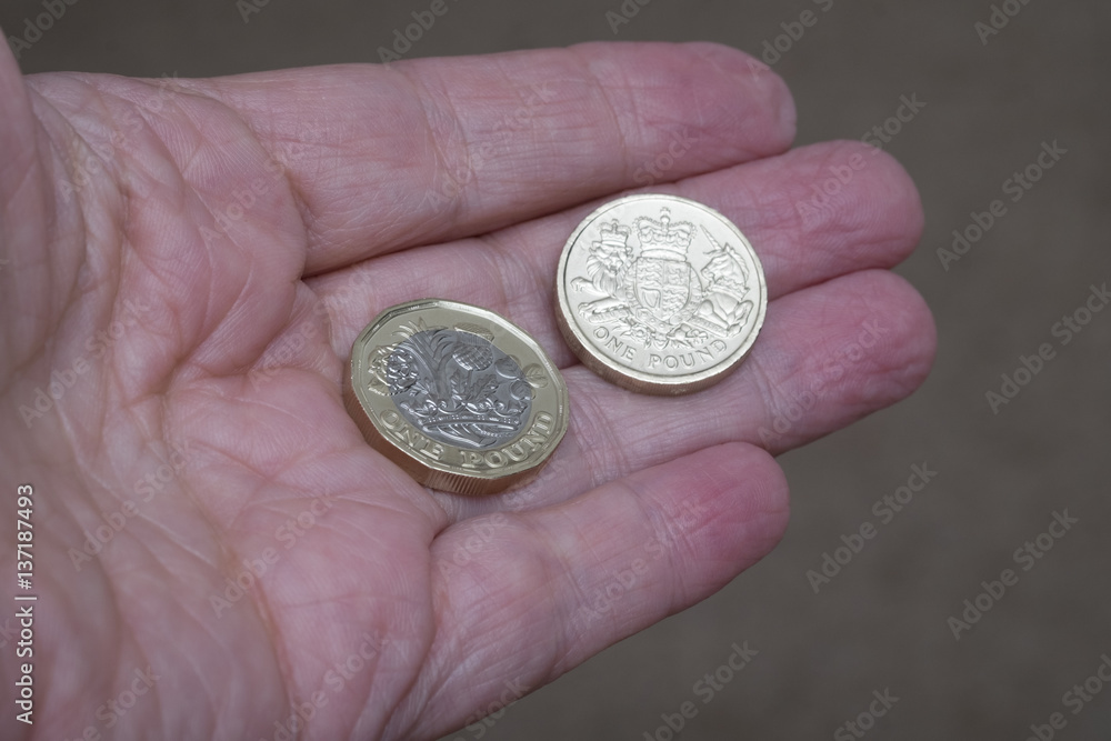New and old design of british pound sterling coin New and old design of british pound sterling coin