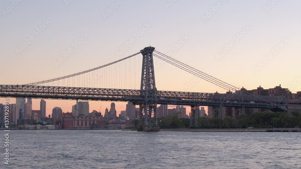 HYPERLAPSE: Williamsburg Bridge and residential area in Manhattan, NYC at sunset HYPERLAPSE: Williamsburg Bridge and residential area in Manhattan, NYC at sunset