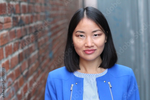 Fotografie Stylish Asian businesswoman close up with copy space