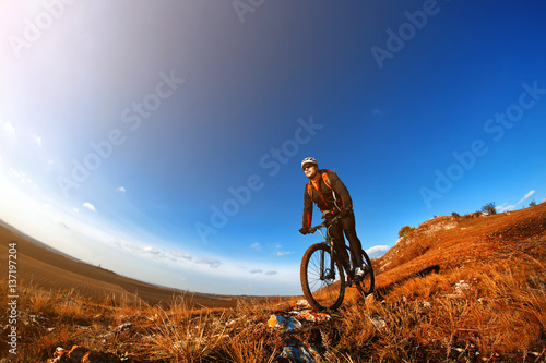 Wallpaper Mural Mountain Bike cyclist riding single track outdoor with blue sky on background Torontodigital.ca
