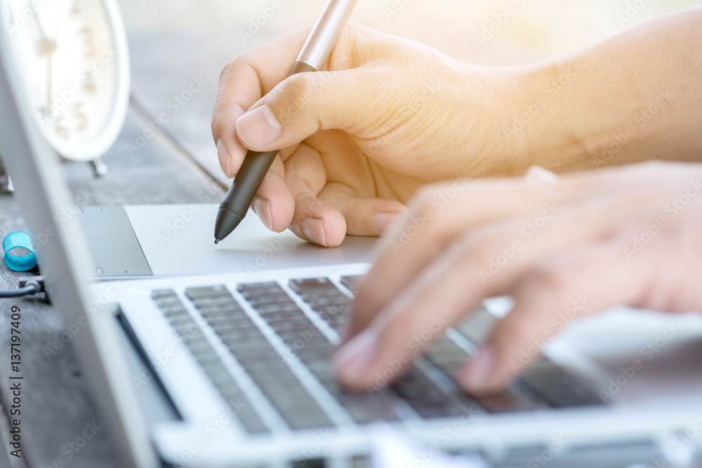 hand working with laptop and pen digital tablet hand working with laptop and pen digital tablet