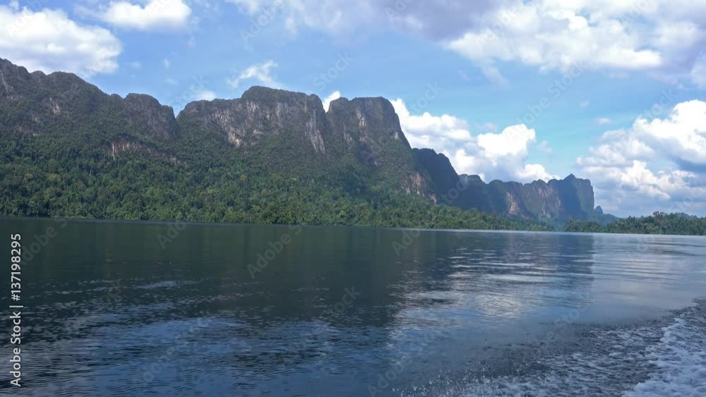 View from boat on Cheow Lan lake in National Park Khao Sok, Thailand, 4k
View from boat on Cheow Lan lake in National Park Khao Sok, Thailand, 4k