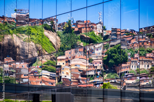 Reflection of Brazilian Slum in Windows of New Modern Business Building in Rio de Janeiro