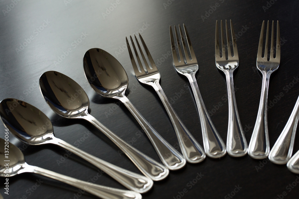 Cutlery on a black background. Fork, spoon, knife. Cutlery on a black background. Fork, spoon, knife.