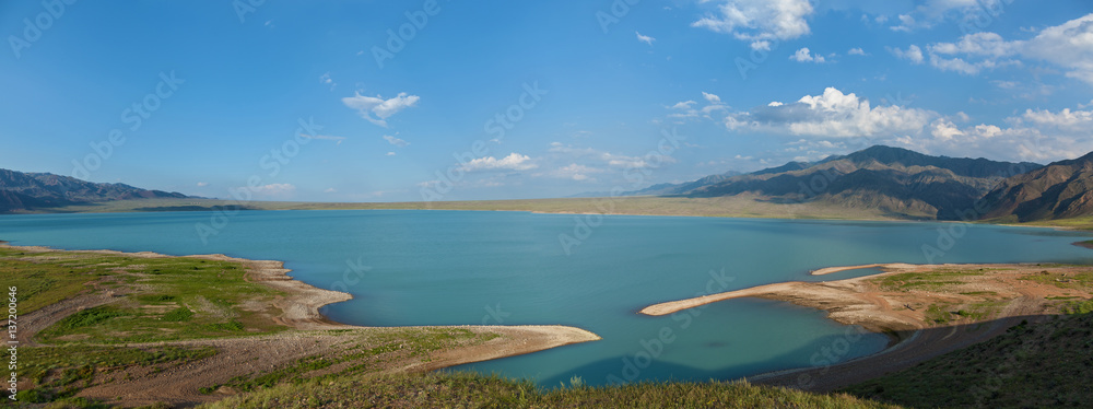 Bartogai dam on a mountain river Chilik, Kazakhstan upcast of water