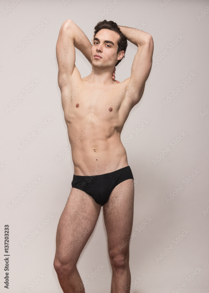 young man model posing arms raised