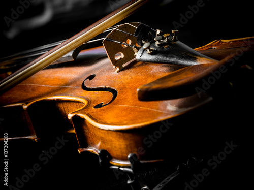 violin close up on black background photo